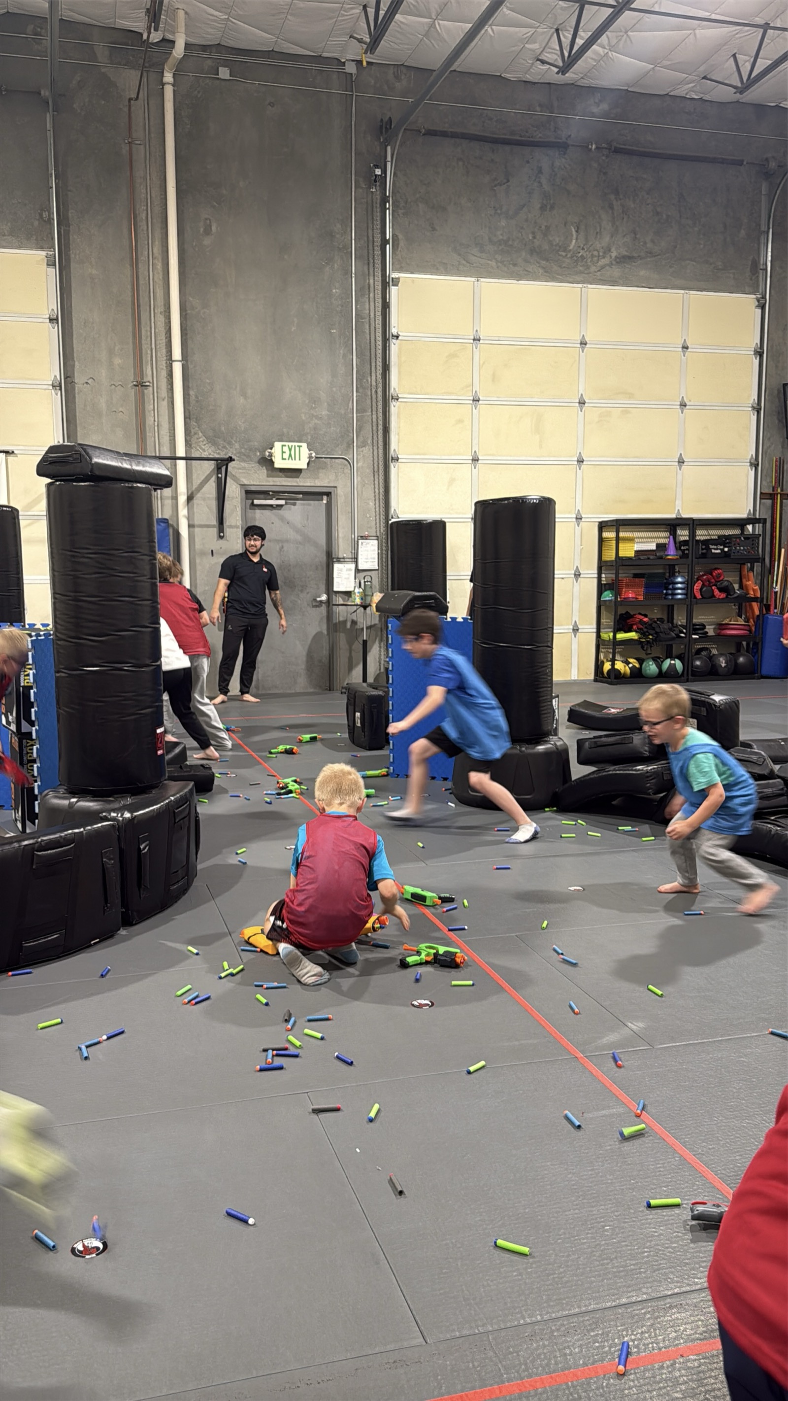 Kids in a Nerf battle at Legacy Martial Arts